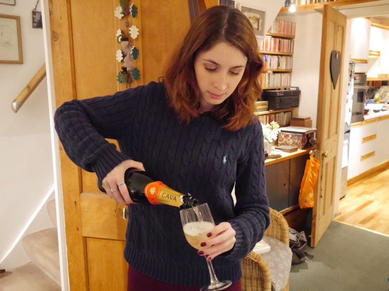 Blogger pouring Prosecco